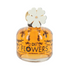 A bottle of Designer Brands Fragrance Flowers EDP 100ML with a white label featuring a flower design and the text 'Parfum de Toilette pour Femmes.