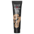 A tube of Revlon ColorStay Full Cover Foundation in the shade 'Warm Golden'. The packaging is predominantly black with product details displayed in white and yellow text.