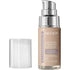 A pump bottle of Revlon Illuminance Liquid Foundation in Beige color, with the cap removed.